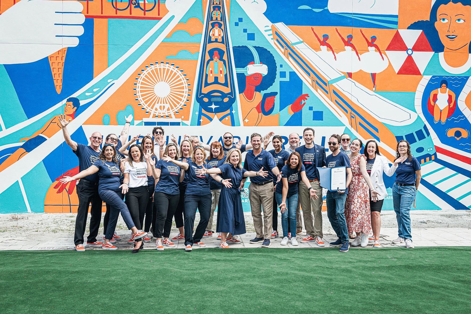 Visit Orlando team members and community members pictured at the Unbelievably Real mural in downtown Orlando. 
